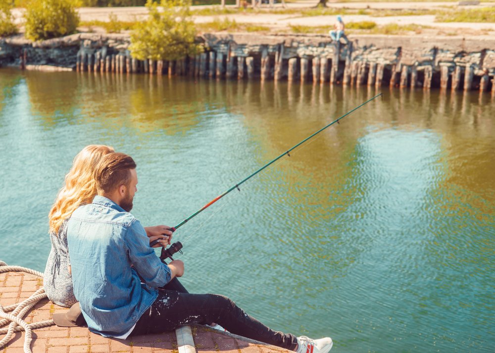girl fishing with boyfriend